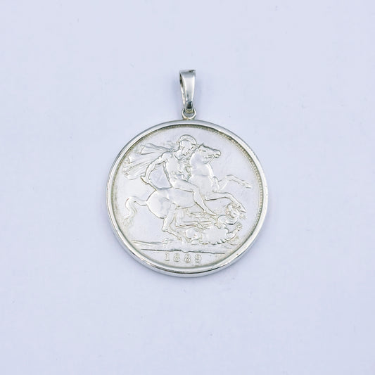 Sterling silver pendant featuring an 1889 Queen Victoria coin, set in a silver frame with a 4cm diameter loop, weighing approximately 32.1g