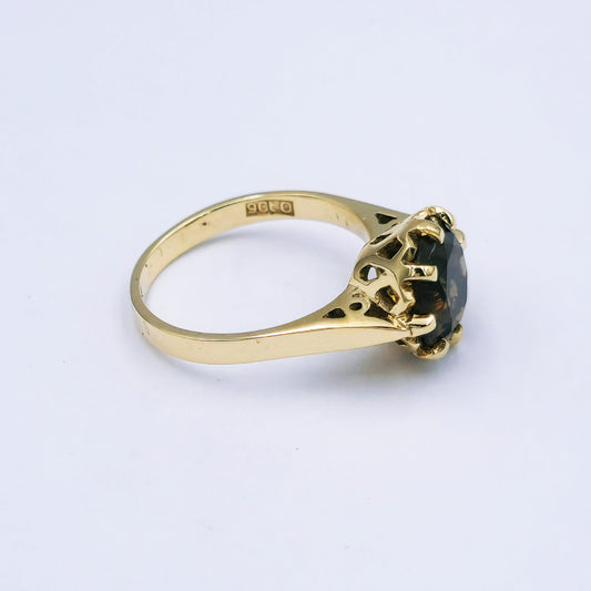 9ct yellow gold ring featuring a 10mm round smokey quartz in an eight-claw setting with pierced side detail, ring size O, approx. 3.7g