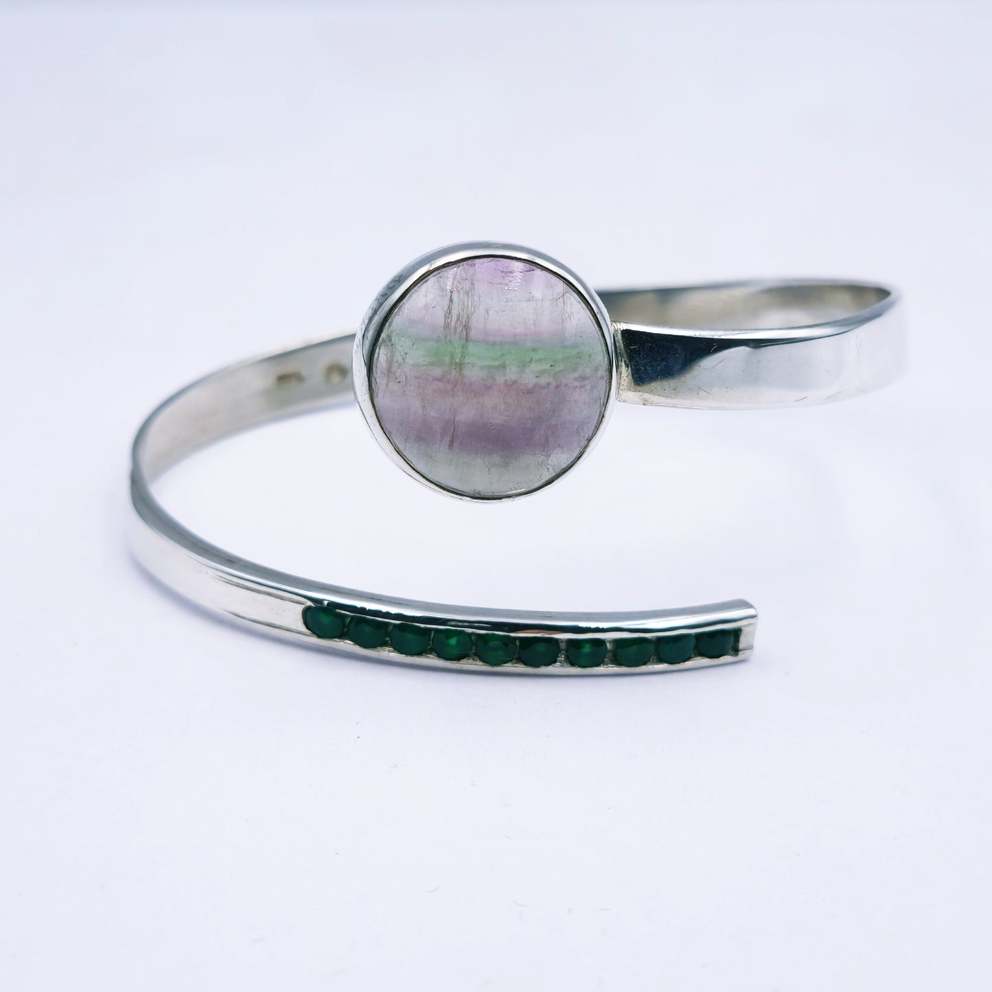Sterling silver handmade open bangle with 20mm fluorite gemstone and channel-set green agates, adjustable size.