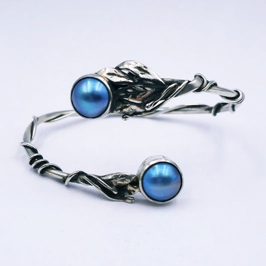 Handmade sterling silver bangle with two blue/grey mabe pearls and decorative leaf and stalk design, solid 3mm round bangle, 65mm diameter.