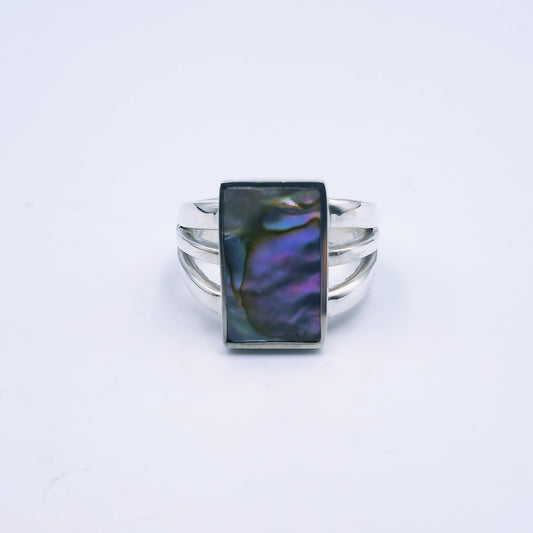 Three-band sterling silver ring featuring a rectangular abalone shell with rich iridescent tones, handmade and polished to a shine.