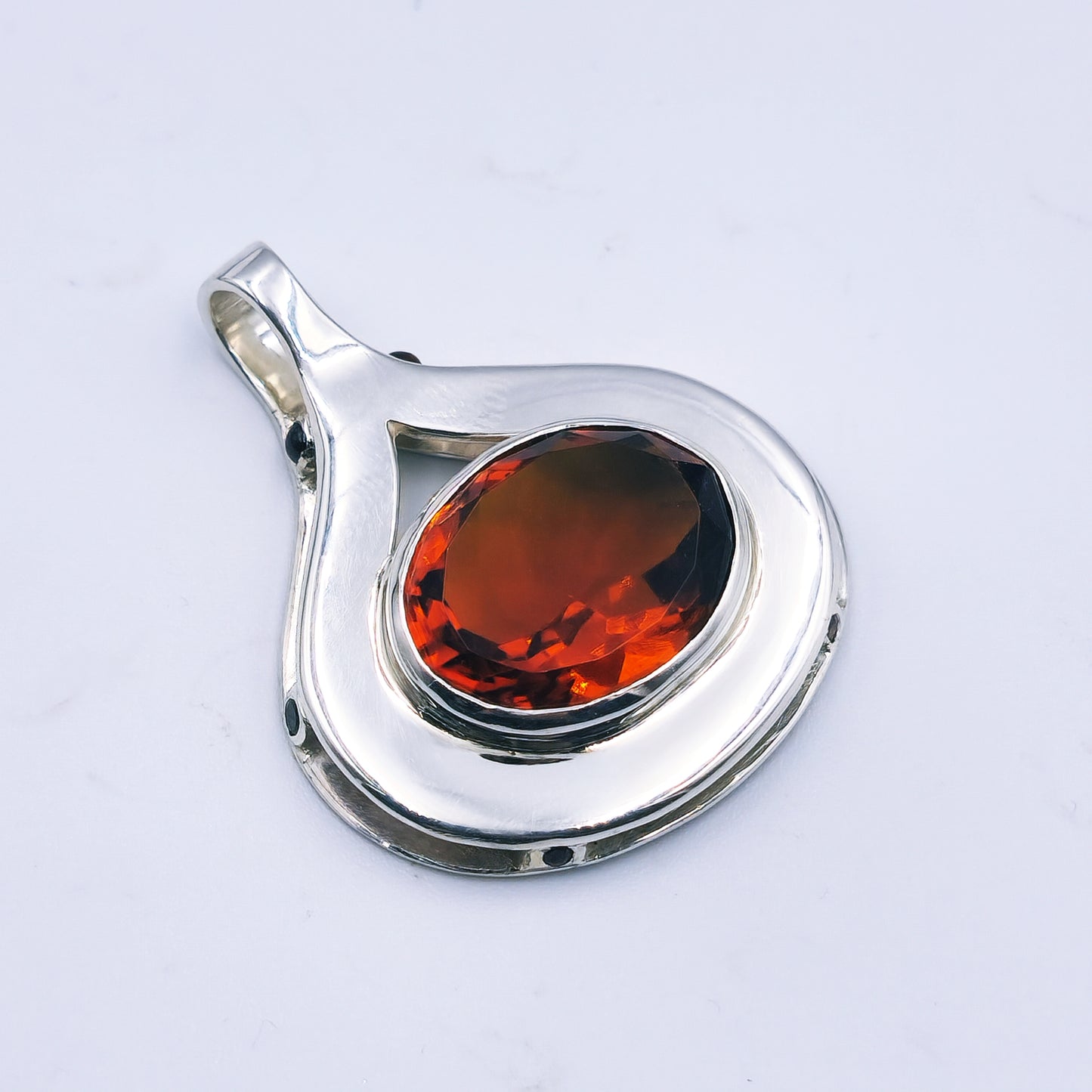Sterling silver pendant with oval citrine and six garnets in a reinvented Scottish style.
