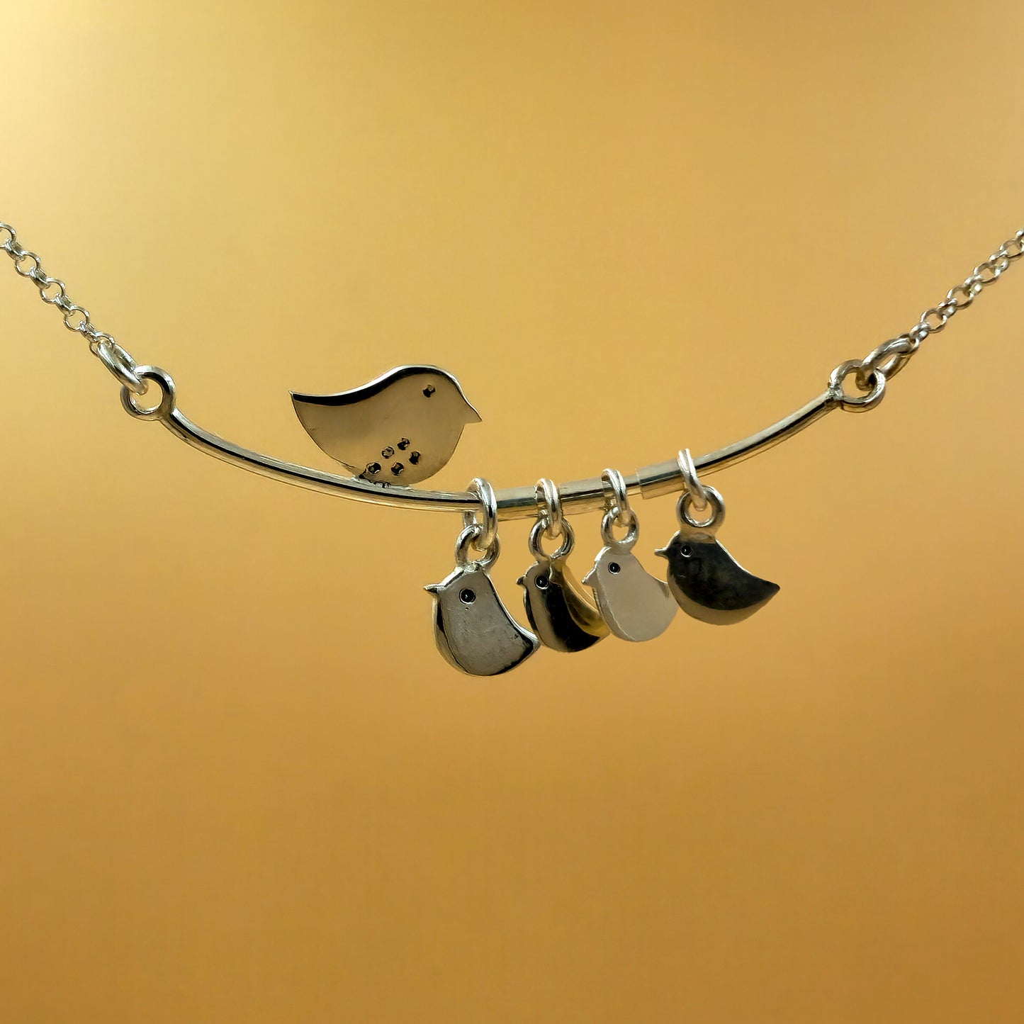 Sterling silver mommy necklace with four baby chic pendants on a handmade 48cm chain, perfect for engraving each child’s initial.