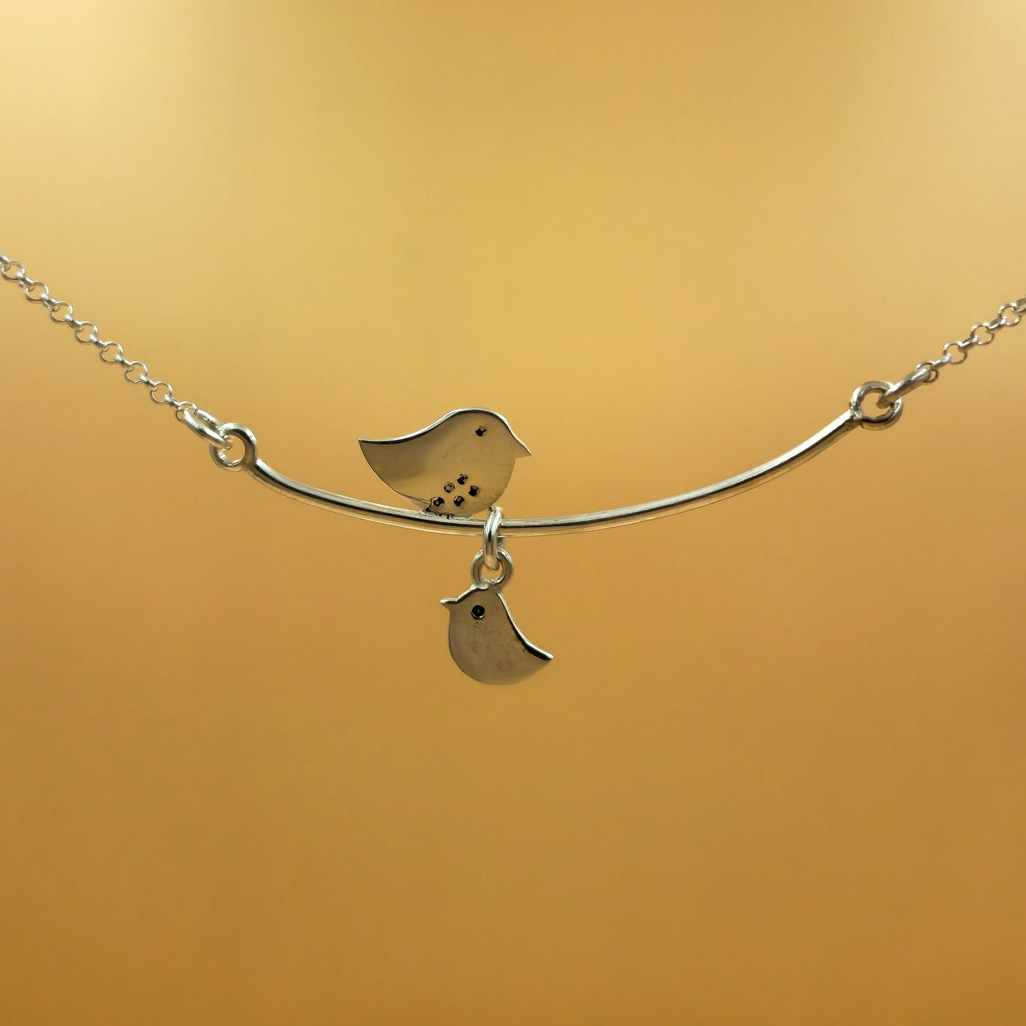 Sterling silver mommy necklace with a central fixed pendant and one baby chic charm on a 48cm chain, engravable initial option.