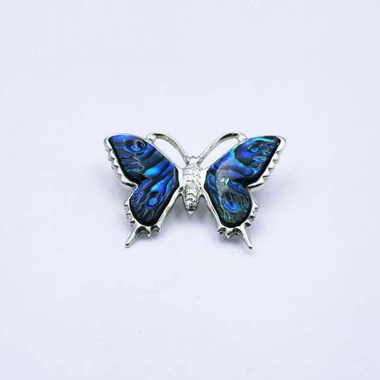 Sterling silver butterfly brooch with abalone shell wings in shades of teal and blue, measuring approx. 2.7cm high by 3.1cm wide, weighing 8.1g