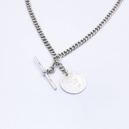 Antique sterling silver 43cm curb chain with stamped links, featuring two swivel clasps, a T-bar fob, and a 1826 Georgius IV Dei Gratia coin pendant; approx. 37.1g in weight