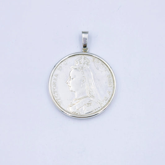 Sterling silver pendant featuring an 1889 Queen Victoria coin, set in a silver frame with a 4cm diameter loop, weighing approximately 32.1g