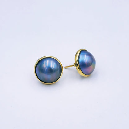 Pair of 9ct yellow gold stud earrings with round peacock blue/grey marbe pearls (12mm diameter) in classic gold frames with butterfly backs.