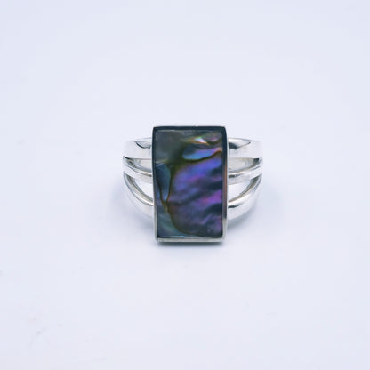 Three-band sterling silver ring featuring a rectangular abalone shell with rich iridescent tones, handmade and polished to a shine.