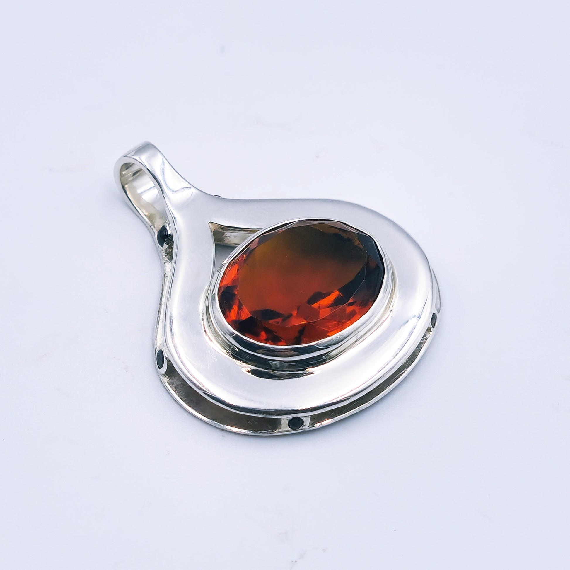 Sterling silver pendant with oval citrine and six garnets in a reinvented Scottish style.